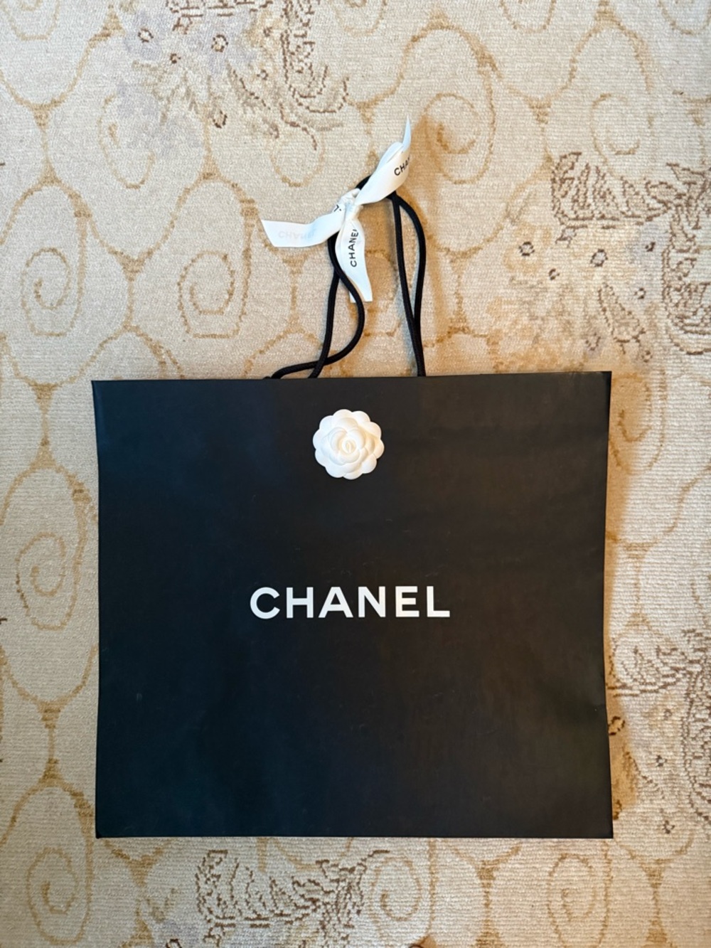 CHANEL Black Shopping Tote with White Camellia Accent